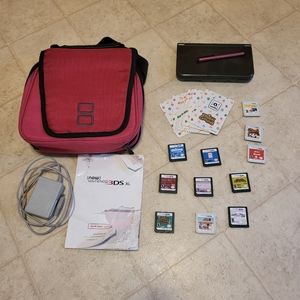 Nintendo 3DS with pink case, charger, and  11 games